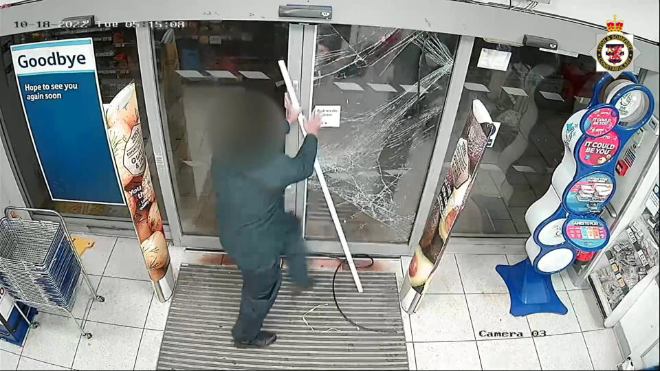 After being confronted by a brave shop worker, James then tried to smash his way through the door. (SWNS)
