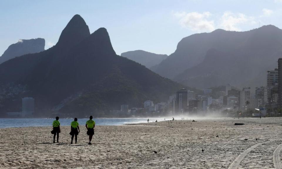 Police officers patrol Ipanema beach, amid the coronavirus lockdown