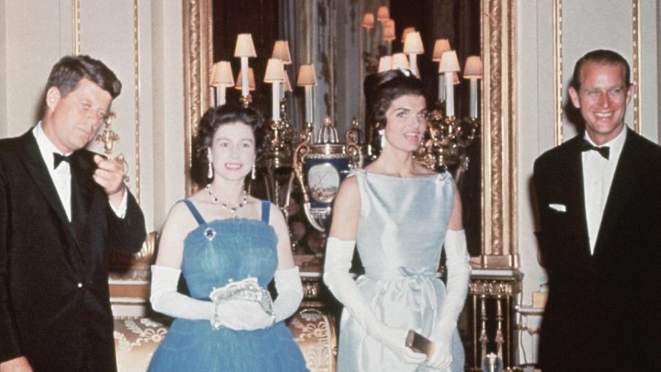 Queen Elizabeth and Prince Philip standing with the Kennedys