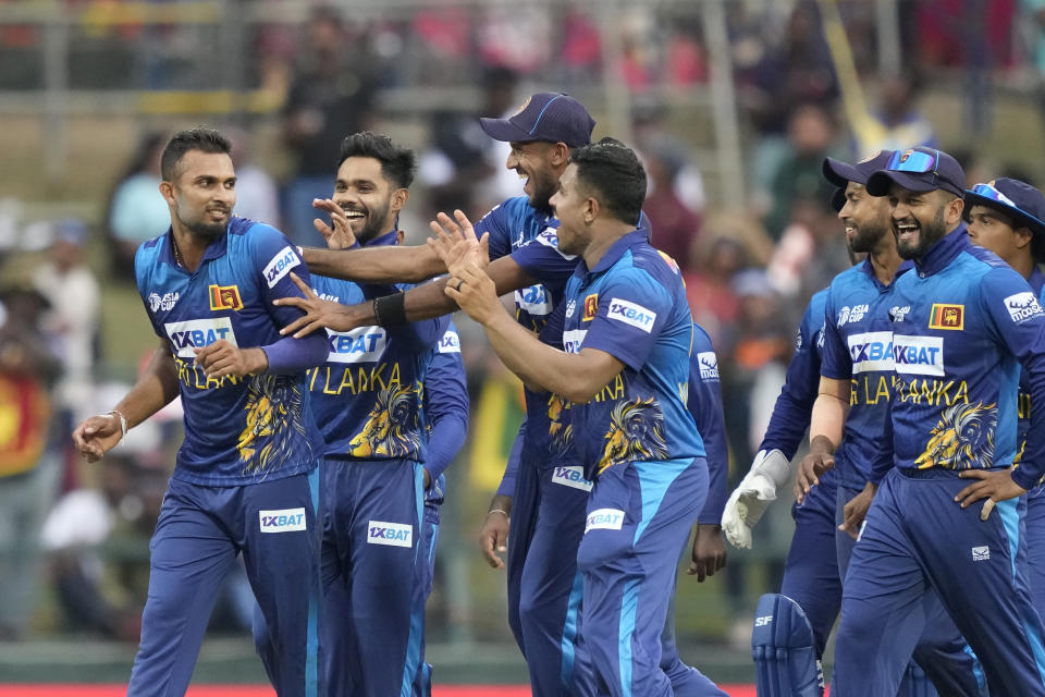 Sri Lankan team members congratulate Dasun Shanaka, left, for taking the wicket of Bangladeshes' Towhid Hridoy during the one day international cricket match between Sri Lanka and Bangladesh of Asia Cup in Pallekele, Sri Lanka on Thursday, Aug. 31. (AP Photo/Eranga Jayawardena)