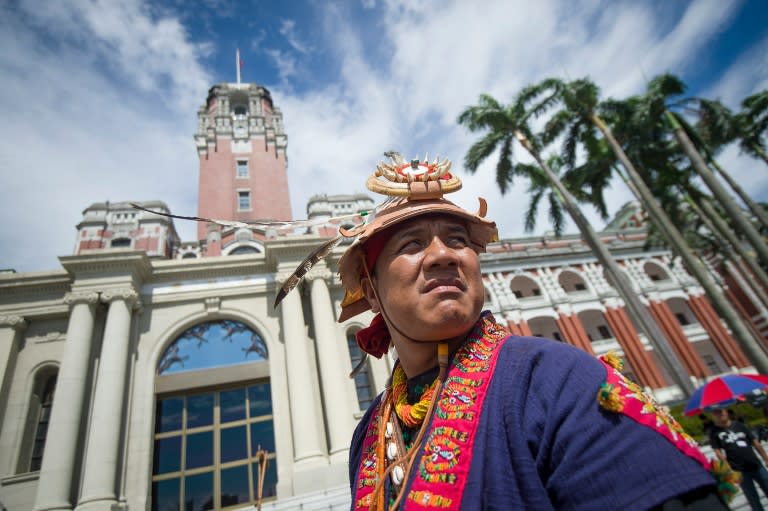 A representatives of Taiwan's indigenous communities arrives at the presidential office in traditional dress on August 1, 2016