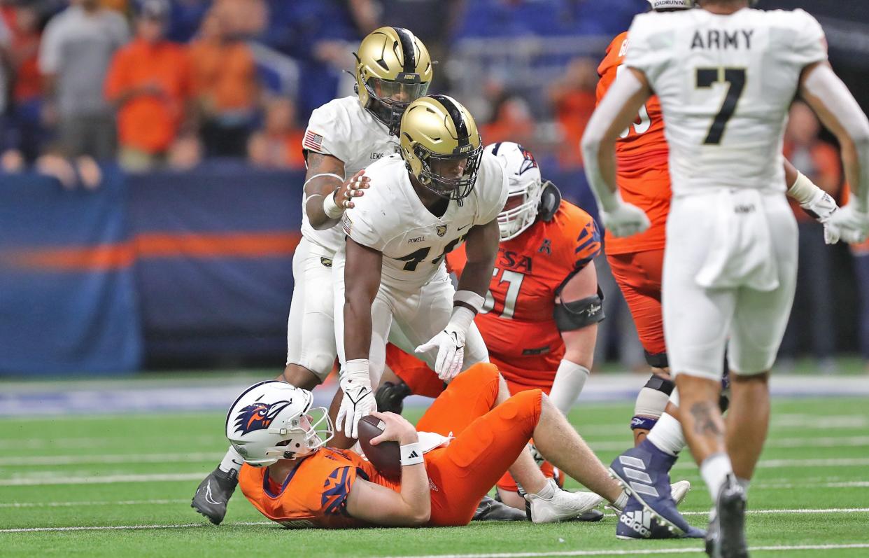 Army linebacker Jackson Powell (49) celebrates his sack of UTSA quarterback Eddie Lee Marburger (12) during the fourth quarter at the Alamodome.