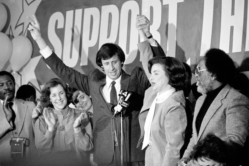 San Francisco Mayor Dianne Feinstein has her arm raised by her husband, Richard Blum, following her recall victory in San Francisco, Tuesday, April 27, 1983. She easily survived the recall election that was spawned by handgun ban which was never enforced. (AP Photo/Carl Viti)