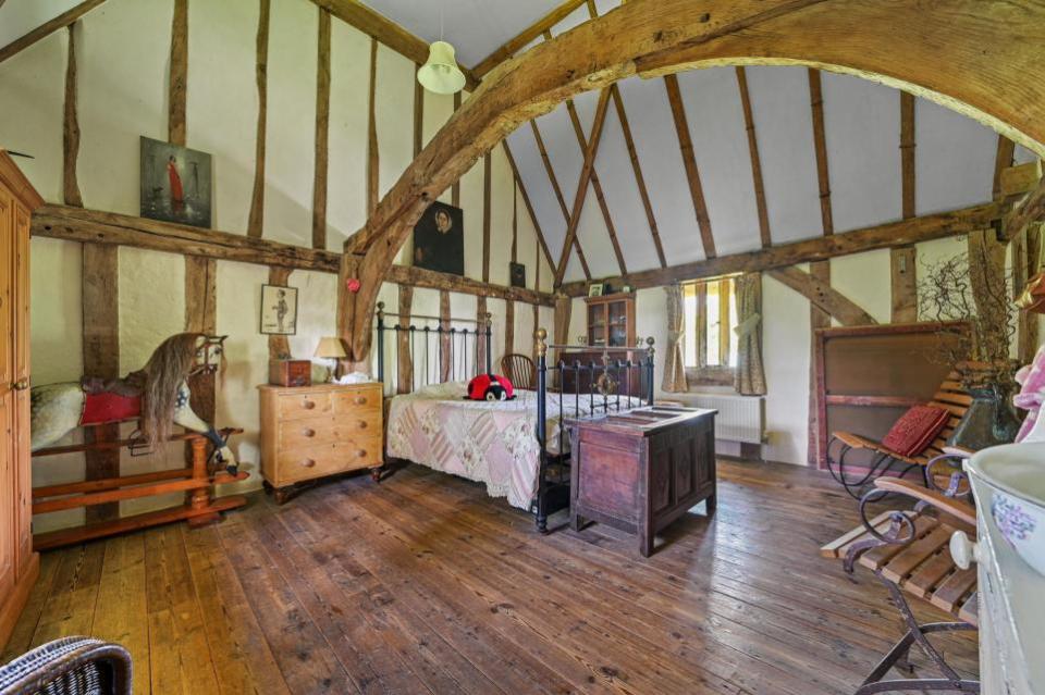 East Anglian Daily Times: A grand, arched tie beam hangs over bedroom one