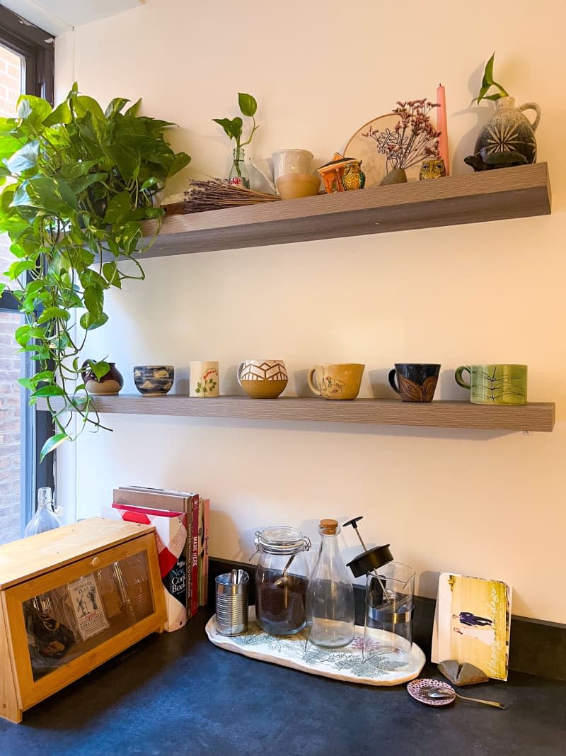 <span>Here's another floating shelf situation in my kitchen. I love ceramics and started collecting handmade mugs from small makers a few years ago, and this is the first apartment I've actually been able to display them in the open! I really love choosing which one I'm going to drink from each day depending on my mood. From left to right, the mugs are from (on Instagram): - @potterybym - unsure--bought at a market and haven't been able to find their Insta! - @laurachautin (she's NYC based!) - also unsure-- another market purchase - @windrainalice - @carlynne.ceramics (also NYC based!!) - @hessaalajmani Credit: Sarah M</span> <span class="copyright">Credit: Sarah M</span>