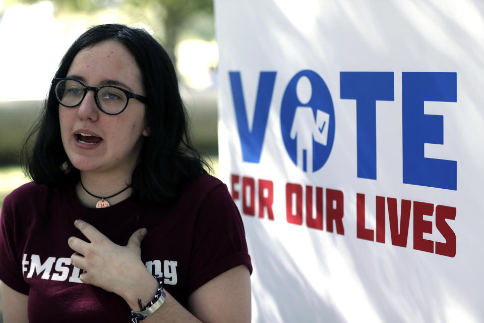 In this Wednesday, Oct. 31, 2018 photo, Sofie Whitney, activist and student at Marjory Stoneman Douglas High School in Parkland, Florida, talks about voting during a Vote for Our Lives event at the University of Central Florida in Orlando, Fla. Nine months after 17 classmates and teachers were gunned down at their Florida school, Parkland students are finally facing the moment they’ve been leading up to with marches, school walkouts and voter-registration events throughout the country: their first Election Day. (AP Photo/John Raoux)