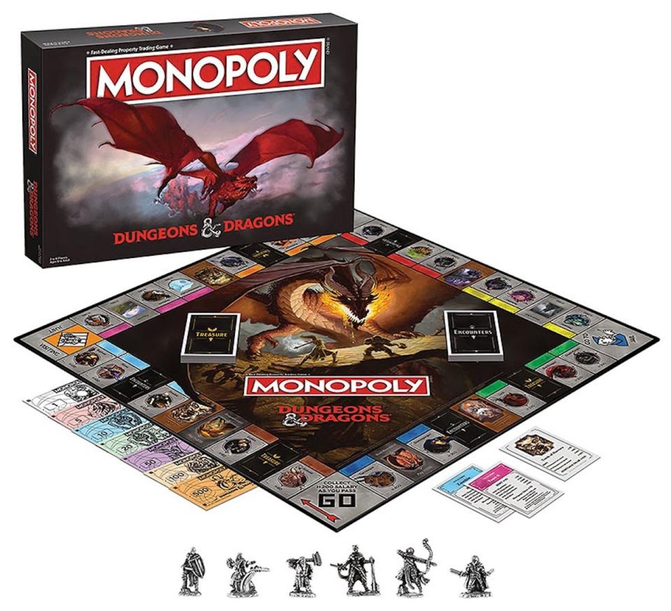 Monopoly Dungeons & Dragons, with the box standing next to the full game set up, with six tokens in front