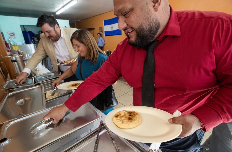 Brian Rivera, with Initiating Change in Our Neighborhood (ICON), uses a reusable plate.