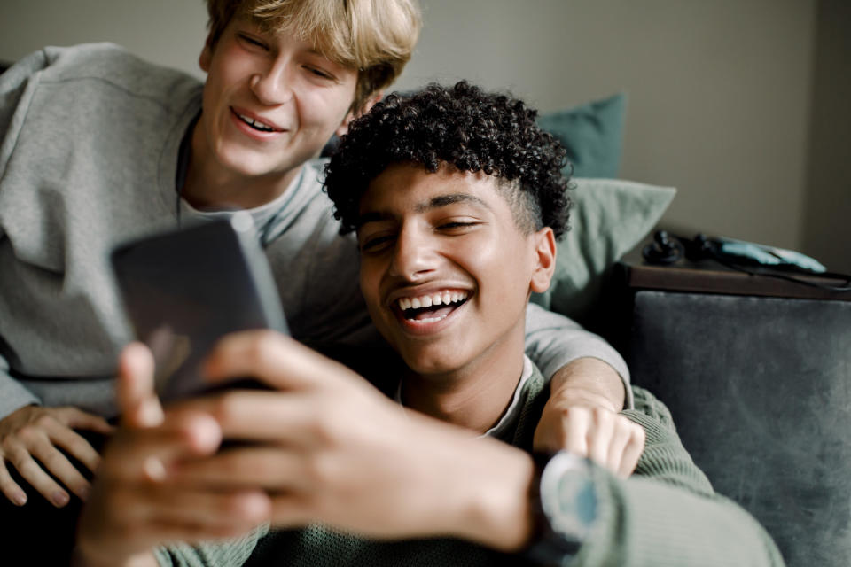 two people looking at a phone