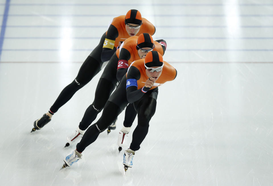 Speedskaters from team Netherlands, from back to front, Sven Kramer, Jan Blokhuijsen, Koen Verweij compete in the men's speedskating team pursuit quarterfinals at the Adler Arena Skating Center during the 2014 Winter Olympics in Sochi, Russia, Friday, Feb. 21, 2014. (AP Photo/Pavel Golovkin)