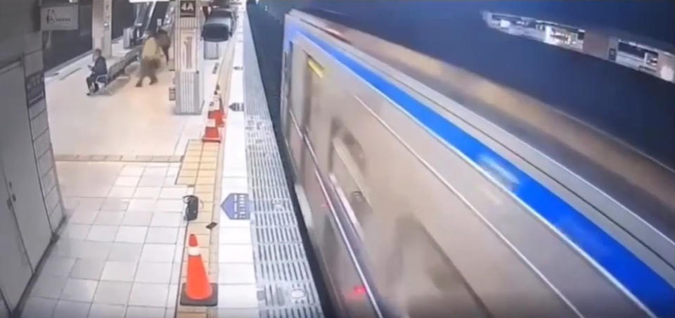 Train passes over woman who fell on tracks in Taipei, Taiwan. 