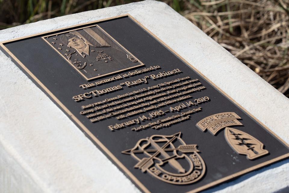 A memorial plaque honors Sgt. 1st Class Thomas "Rusty" Robinett, a Green Beret in the Army 7th Special Forces Group (Airborne) who died in a boating accident on Choctawhatchee Bay in 2019.