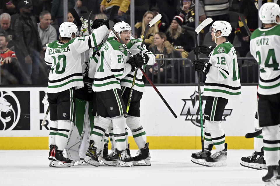 The Dallas Stars celebrate an overtime win against the Vegas Golden Knights in an NHL hockey game Saturday, Feb. 25, 2023, in Las Vegas. (AP Photo/David Becker)