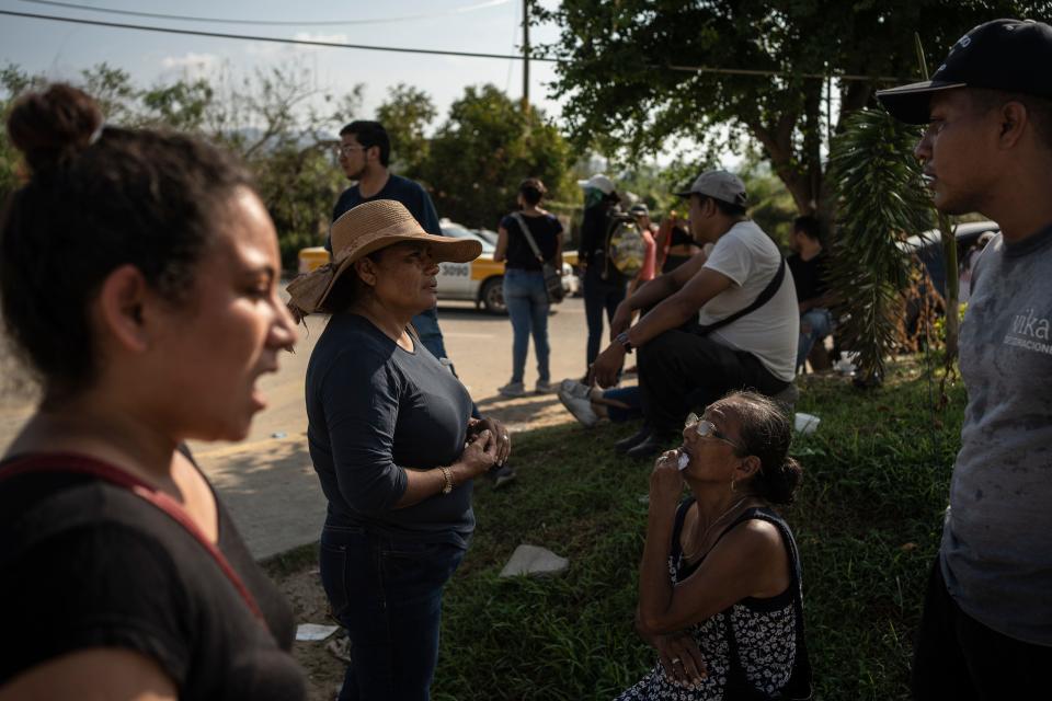 Relatives of hurricane Otis victims seek information outside a morgue in Acapulco, Mexico, Sunday, Oct. 29, 2023.