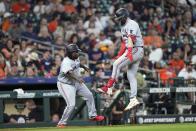 Minnesota Twins' Ryan Jeffers, right, celebrates with third base coach Tommy Watkins after hitting a home run against the Houston Astros during the 10th inning of a baseball game Monday, May 29, 2023, in Houston. (AP Photo/David J. Phillip)