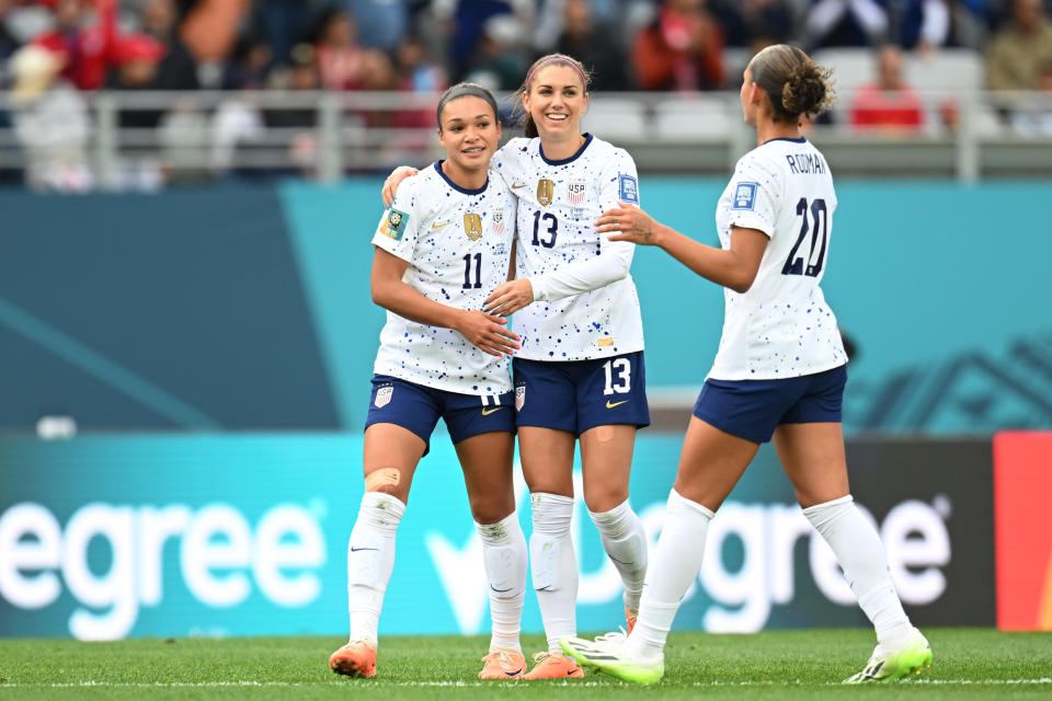 AUCKLAND, NEW ZEALAND - JULY 22: Sophia Smith (L) of USA celebrates with teammates Alex Morgan (C) and Trinity Rodman (R) after scoring her team&#39;s second goal during the FIFA Women&#39;s World Cup Australia & New Zealand 2023 Group E match between USA and Vietnam at Eden Park on July 22, 2023 in Auckland / T&#x000101;maki Makaurau, New Zealand. (Photo by Hannah Peters - FIFA/FIFA via Getty Images)