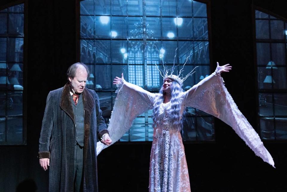 Terry Edward Moore as Ebenezer Scrooge and Samantha Chung as the Ghost of Christmas Past in Harlequin Productions’ 2023 presentation of “A Christmas Carol.”