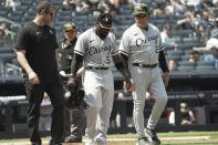 Chicago White Sox manager Tony La Russa, right, walks with second baseman Josh Harrison (5) to first base after he was grazed by a pitch in the fifth inning of a baseball game against New York Yankees, Saturday May 21, 2022, in New York. (AP Photo/Bebeto Matthews)