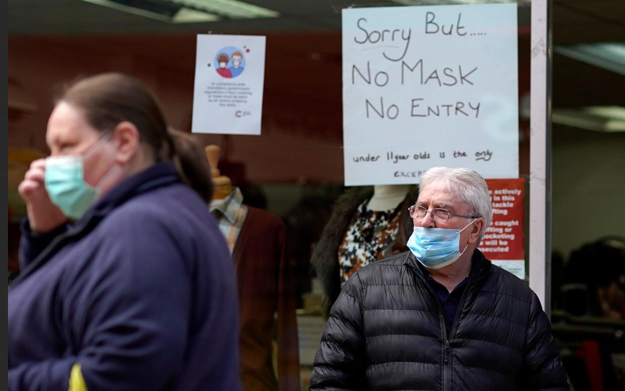 Shoppers in Blackburn, where face masks are compulsory in stores - GETTY IMAGES