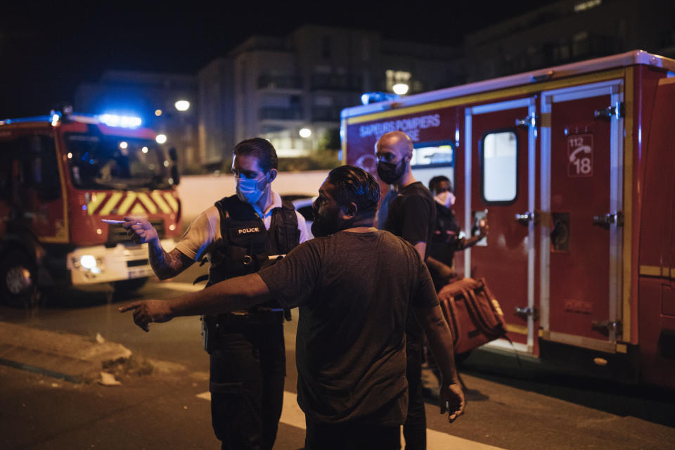 Police officer Damien, 30, questions a witness after a violent brawl in a nearby town, in the Paris suburb of Villiers-le-Bel, Tuesday, June, 15, 2021. Police who patrol the tough suburbs north of the French capital say they feel that violence is ticking upward. Fights between rival groups are a long-standing problem in the Paris region's depressed neighborhoods, and police say they're increasingly bloody. (AP Photo/Lewis Joly)