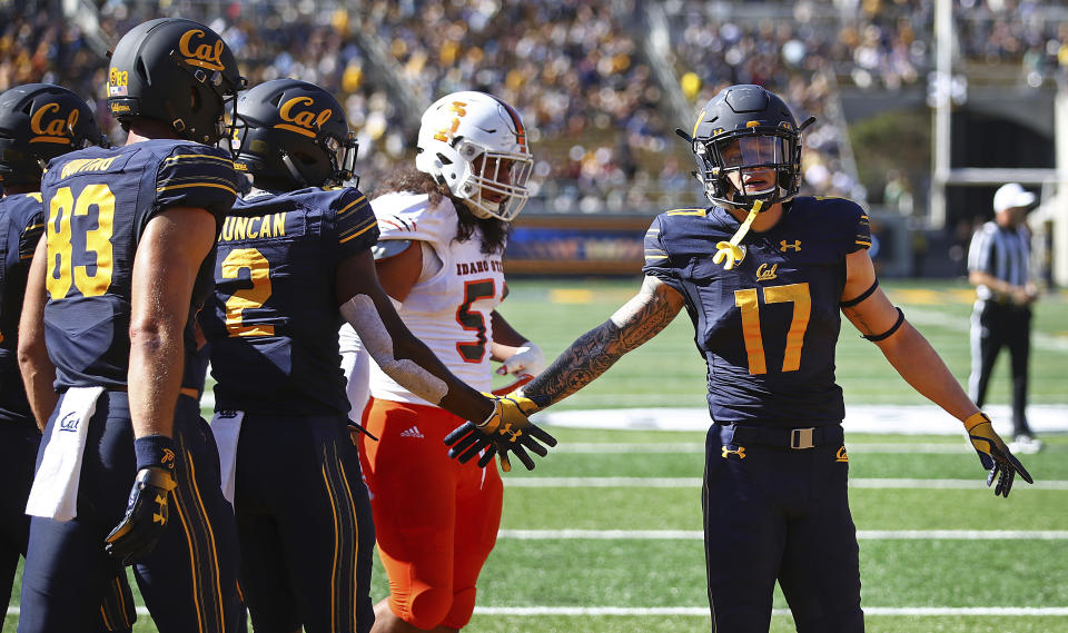 California’s Jordan Duncan (2) celebrates with Vic Wharton III after scoring a touchdown against Idaho State during the first half of an NCAA college football game Saturday, Sept. 15, 2018, in Berkeley, Calif. (AP Photo/Ben Margot)