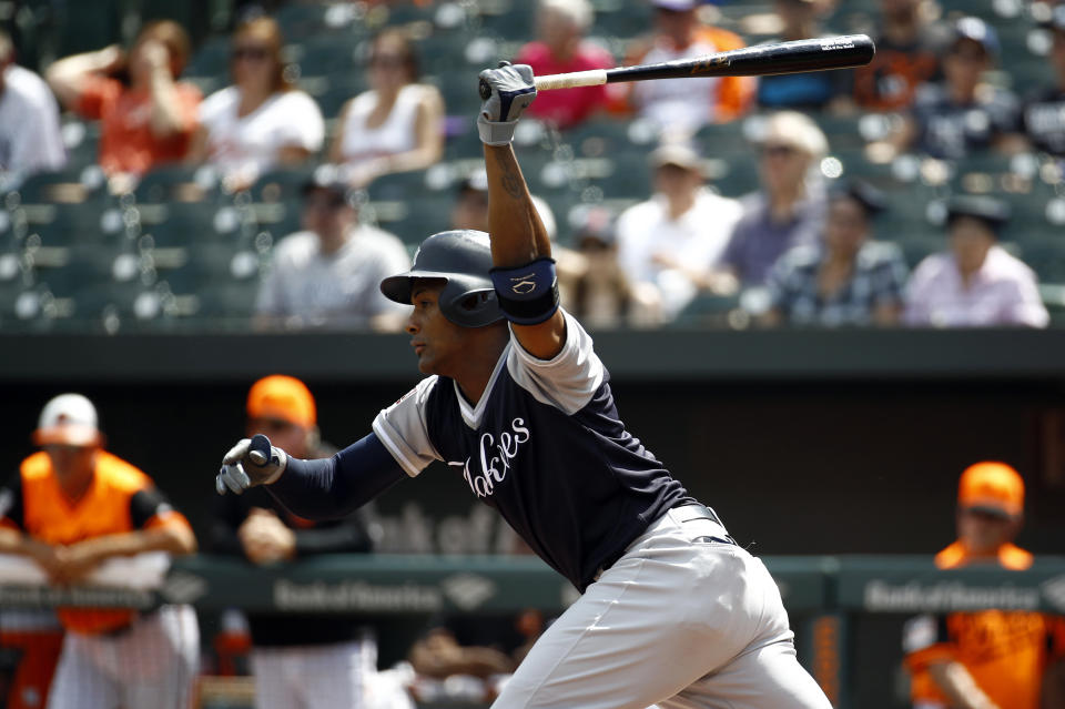 New York Yankees' Miguel Andujar hits a fielder's choice ground ball in the first inning of a baseball game against the Baltimore Orioles, Saturday, Aug. 25, 2018, in Baltimore. Giancarlo Stanton scored on the play. (AP Photo/Patrick Semansky)