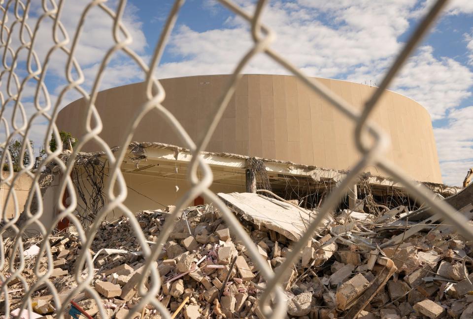 Demolition of the Erwin Center began Tuesday. The arena and the adjacent Cooley Pavilion are being demolished to make way for a new University of Texas specialty care hospital and an MD Anderson Cancer Center.
