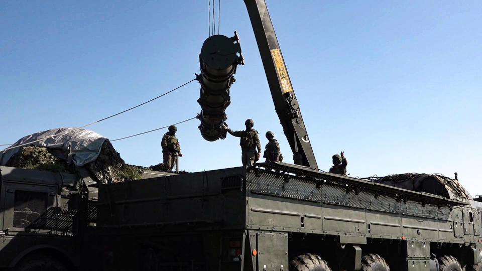 In this photo released by Russian Defense Ministry Press Service on Tuesday, May 21, 2024, Russian troops load an Iskander missile as part of drills to train the military for using tactical nuclear weapons at an undisclosed location in Russia. Russia's Defense Ministry on Tuesday said it began the first round of drills involving tactical nuclear weapons. It was the first time Russia has publicly announced drills involving tactical nuclear weapons, although its strategic nuclear forces regularly hold exercises. (Russian Defense Ministry Press Service via AP)