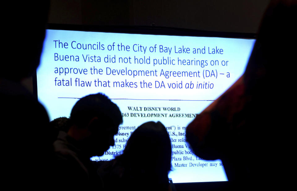A slide, projected during a meeting of the Central Florida Tourism Oversight District Board of Supervisors, summarizes the resolution that was passed to invalidate Disney's final agreement with the previous board, the Reedy Creek Improvement District, Wednesday, April 26, 2023. Florida Gov. Ron DeSantis handpicked the new board in an ongoing dispute with Disney Co. over who controls the special taxing district that manages the municipal infrastructure at Walt Disney World. (Joe Burbank/Orlando Sentinel via AP)
