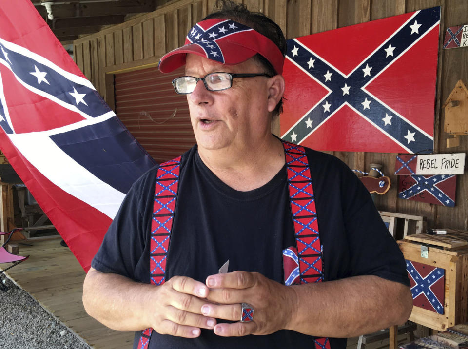 FILE - In this Aug. 17, 2017, file photo, Bob Castello, owner of the Dixie General Store, talks during an interview in Chulafinnee, Ala. Castello makes a living selling hundreds of rebel-themed shirts, hats, car accessories and more in an east Alabama county named for a Confederate officer, Gen. Patrick Cleburne. “Business is very good right now,” Castello said Monday, June 29, 2020. (AP Photo/Jay Reeves, File)