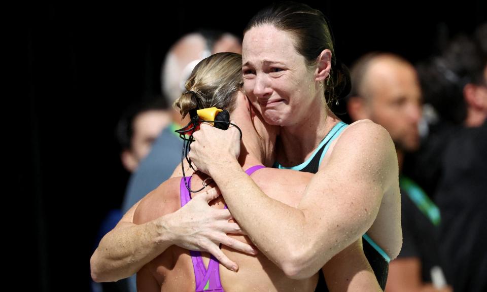 <span>Cate Campbell hugs sister Bronte after missing selection for Paris 2024 at the Australian Swimming Trials.</span><span>Photograph: David Gray/AFP/Getty Images</span>