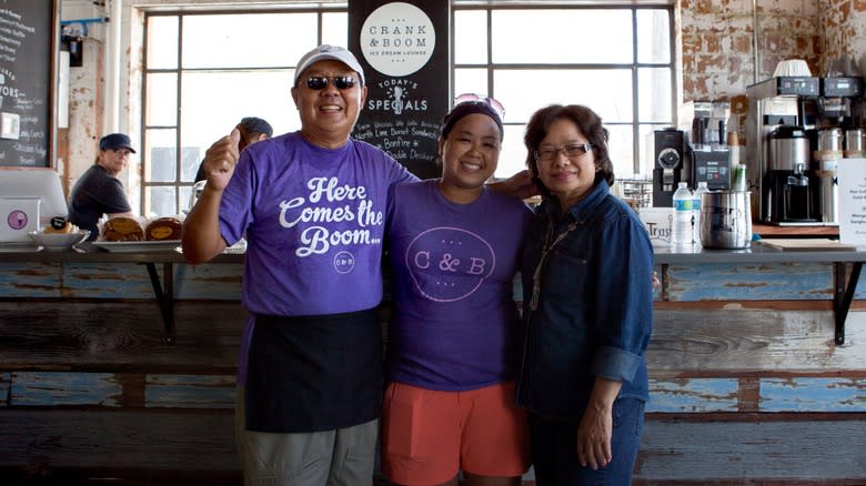 Crank & Boom owners posing in a store