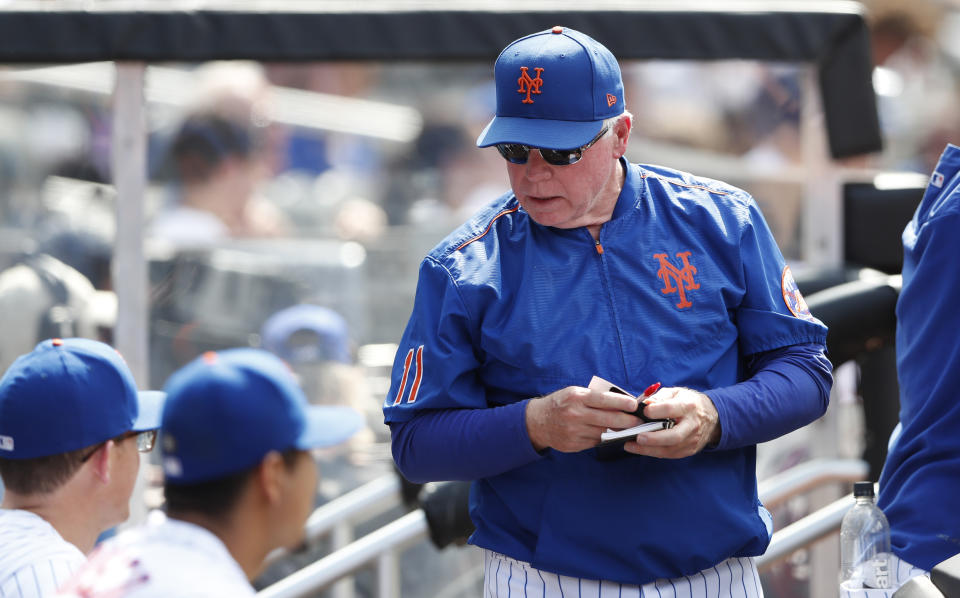 New York Mets manager Buck Showalter (11) stands in the dugout during the sixth inning of a baseball game against the Seattle Mariners, Sunday, May 15, 2022, in New York. (AP Photo/Noah K. Murray)