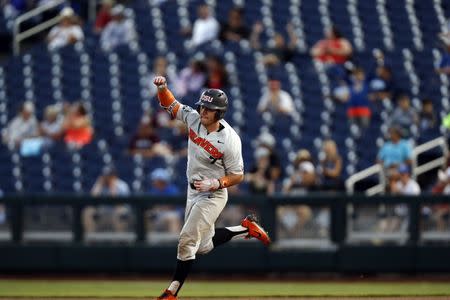 Jun 18, 2018; Omaha, NE, USA; Oregon State Beavers infielder Tyler Malone (7) reacts after hitting a home run against the Washington Huskies in the eighth inning in the College World Series at TD Ameritrade Park. Mandatory Credit: Bruce Thorson-USA TODAY Sports