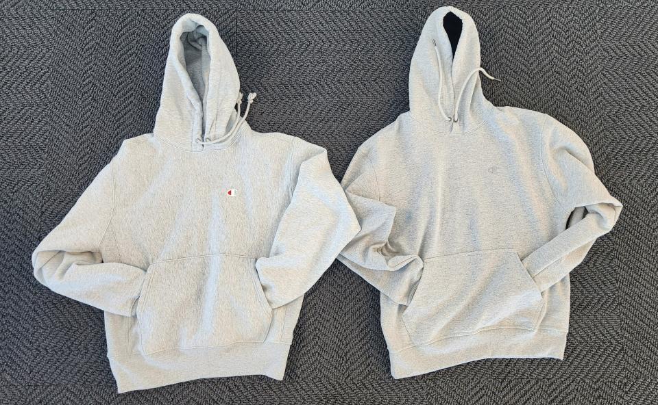 two grey champion hoodies side by side