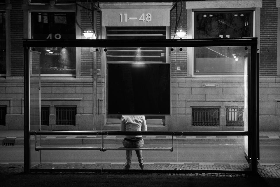 woman at bus stop