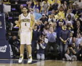 Indiana Pacers' Luis Scola (4) celebrates during the second half in Game 2 of an opening-round NBA basketball playoff series against the Atlanta Hawks Tuesday, April 22, 2014, in Indianapolis. Indiana defeated Atlanta 101-85. (AP Photo/Darron Cummings)