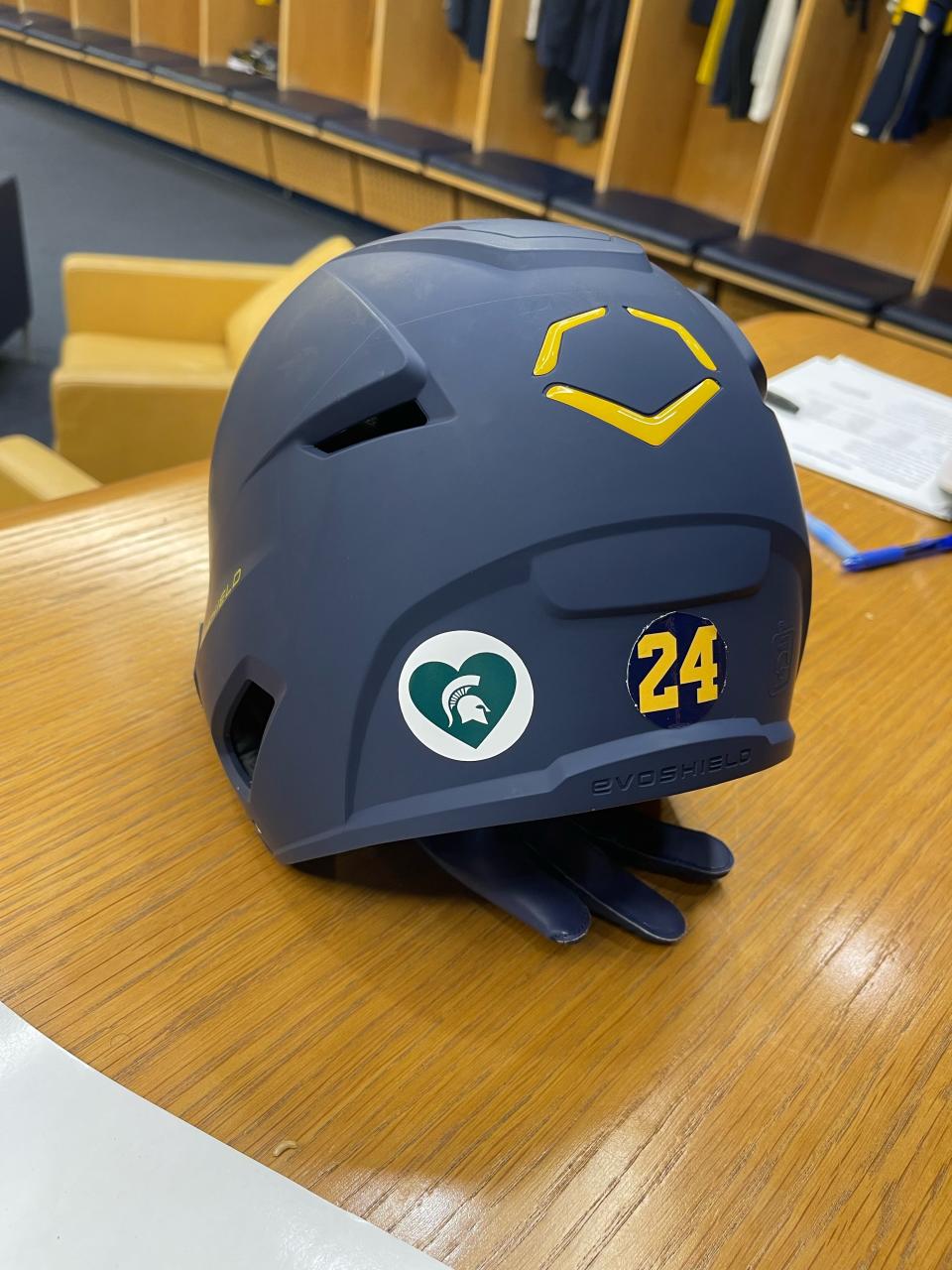 Some of the University of Michigan's athletic teams will wear special helmet decals to honor the victims at Michigan State.