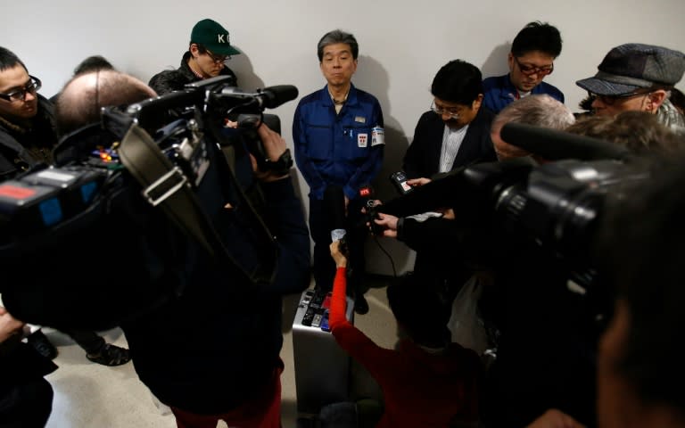 Fukushima chief Akira Ono (centre) speaks to reporters during a media tour of TEPCO's tsunami-crippled nuclear power plant in Okuma, on February 10, 2016