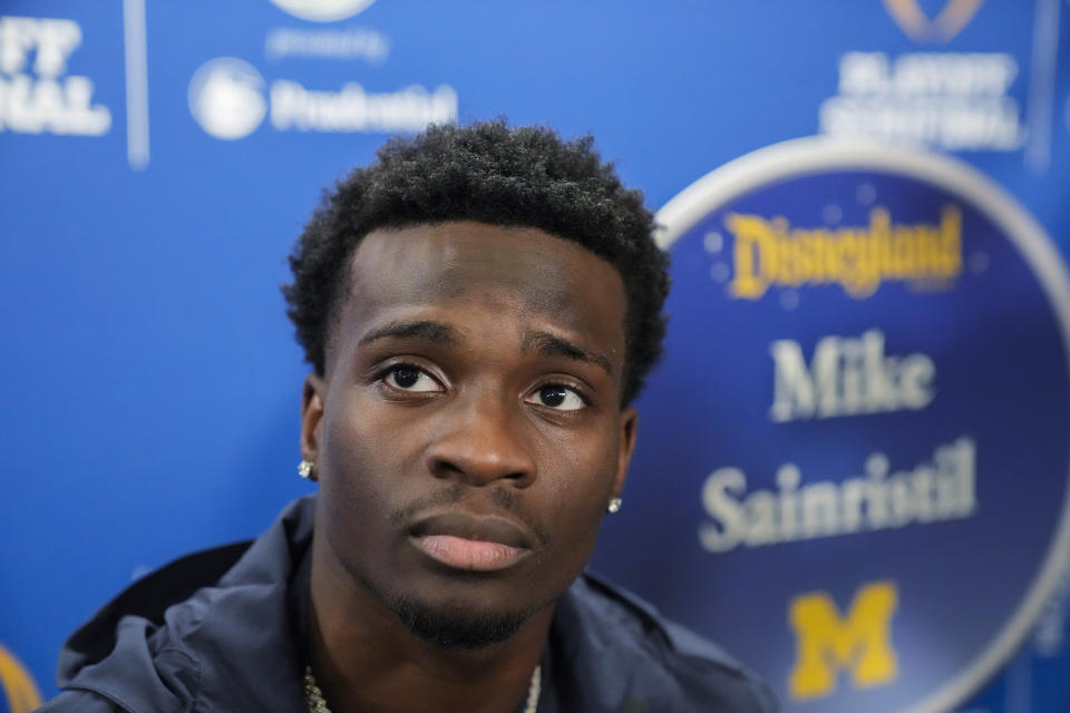 Michigan defensive back Mike Sainristil listens to a question during a welcome event at Disneyland on Wednesday, Dec. 27, 2023, in Anaheim, Calif. Michigan is scheduled to play against Alabama on New Year's Day in the Rose Bowl, a semifinal in the College Football Playoff. (AP Photo/Ryan Sun)