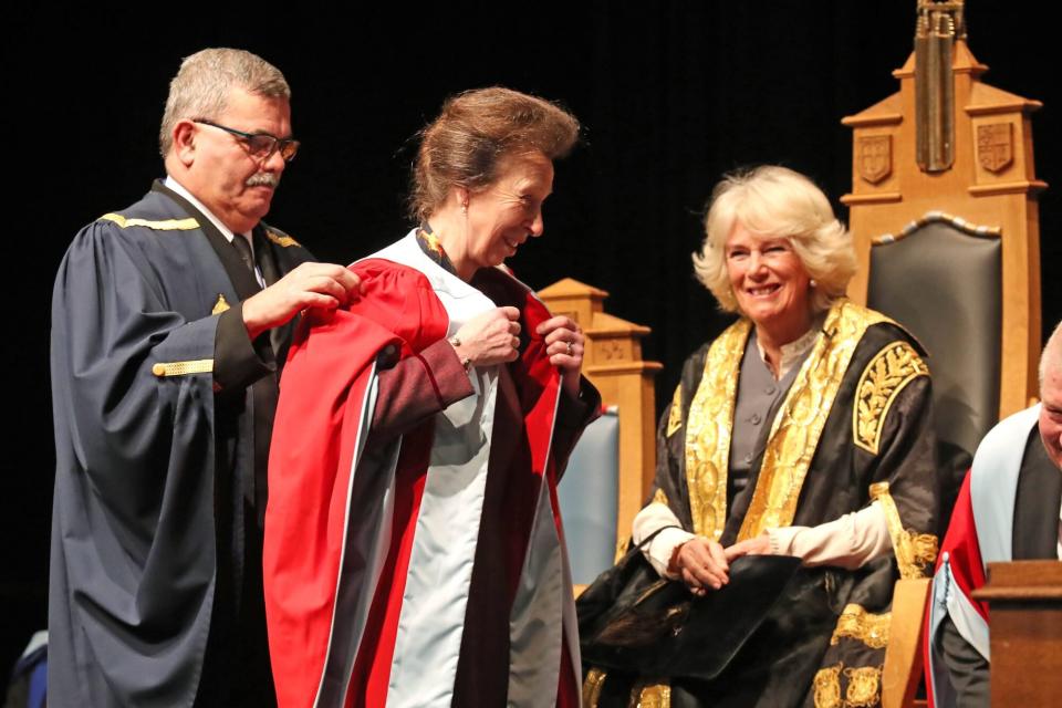 The Duchess of Cornwall (known as the Duchess of Rothesay while in Scotland) presents an honorary degree to her sister-in-law the Princess Royal at the University of Aberdeen. (Photo by Andrew Milligan/PA Images via Getty Images)