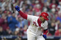 Philadelphia Phillies' Jean Segura celebrates his two-run single during the fourth inning in Game 3 of the baseball NL Championship Series between the San Diego Padres and the Philadelphia Phillies on Friday, Oct. 21, 2022, in Philadelphia. (AP Photo/Matt Slocum)