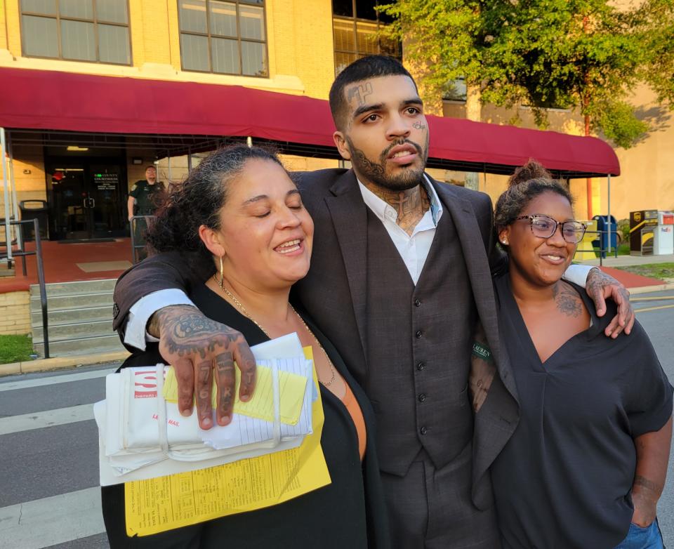 Acquitted of murder in an armed robbery gone awry, Jorge Perez pleads with anyone accused of a crime to not give up hope. He is shown  with his mother, Madeline Peters, left, and sister,  Jazlyn George.