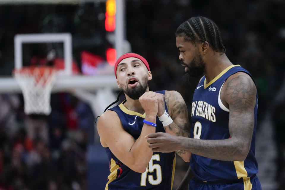 New Orleans Pelicans guard Jose Alvarado (15) celebrates back-to-back baskets with forward Naji Marshall in the first half of an NBA basketball game against the Sacramento Kings in New Orleans, Wednesday, Nov. 22, 2023. (AP Photo/Gerald Herbert)