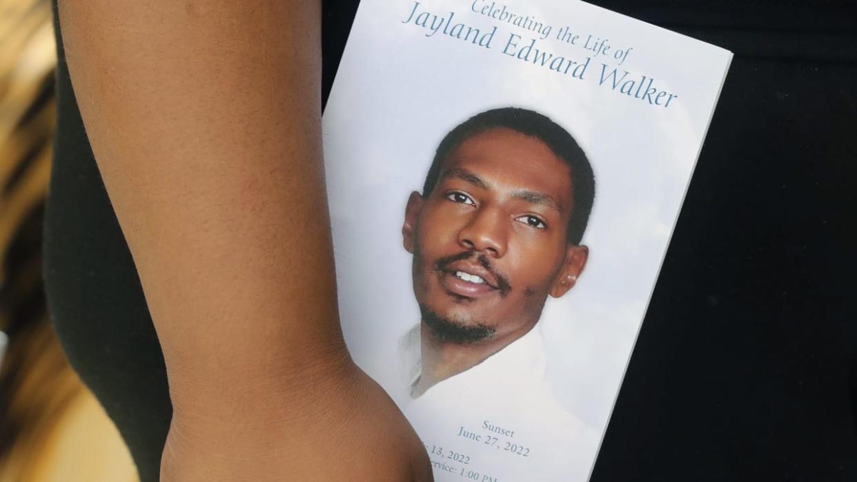 A person leaves the funeral of Jayland Walker at the Akron Civic Theatre on Wednesday, July 13, 2022 in Akron, Ohio. (Phil Masturzo/Akron Beacon Journal via AP)