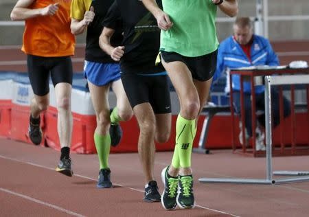 Sportsmen run during a training session at the Brothers Znamensky Olympic Centre in Moscow, Russia, November 10, 2015. REUTERS/Sergei Karpukhin