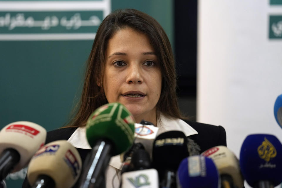 Diala Chehade, one of the lawyers representing the survivors of a drowned migrant boat off the coast of Tripoli, announces lawsuits against the Lebanese Army, accusing them of holding two missing survivors, in Tripoli, northern Lebanon, Thursday, Sept. 1, 2022. In late April, a boat carrying about 80 Lebanese, Syrians, and Palestinians trying to migrate by sea to Italy sunk following a confrontation with the Lebanese navy. (AP Photo/Bilal Hussein)