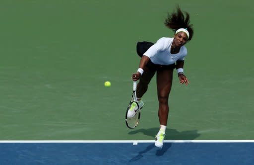 Serena Williams serves against Urszula Radwanska of Poland during day six of the Western & Southern Open at Lindner Family Tennis Center. Williams scratched her way to a 6-4, 6-3 defeat of Radwanska