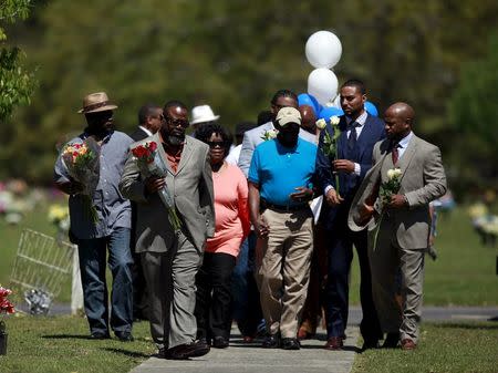 Relatives and friends gathered to remember Walter Scott, at Live Oak Memorial Gardens in Charleston, South Carolina, April 4, 2016. REUTERS/Randal Hill