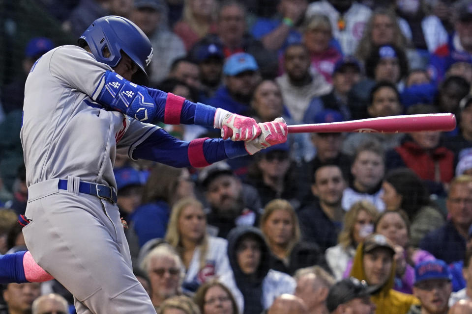 Los Angeles Dodgers' Cody Bellinger hits a one-run single against the Chicago Cubs during the fourth inning of a baseball game in Chicago, Sunday, May 8, 2022. (AP Photo/Nam Y. Huh)